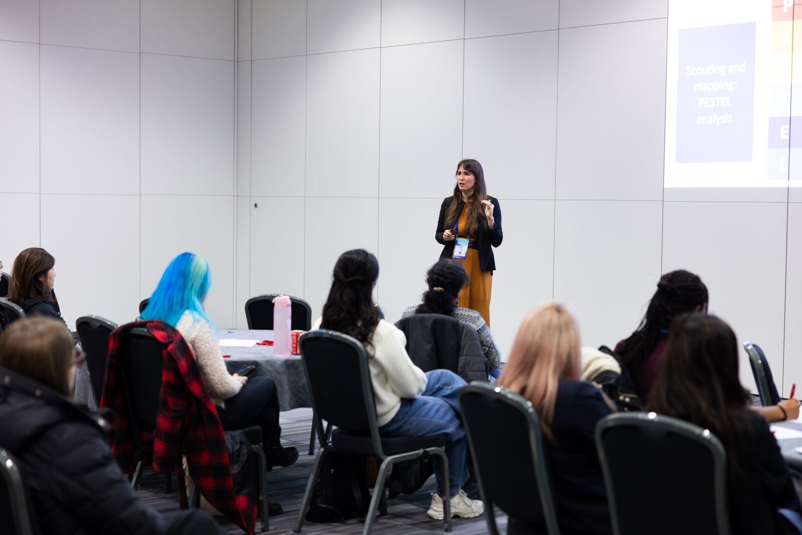 Eleonora presenting to a room of participants during a training session